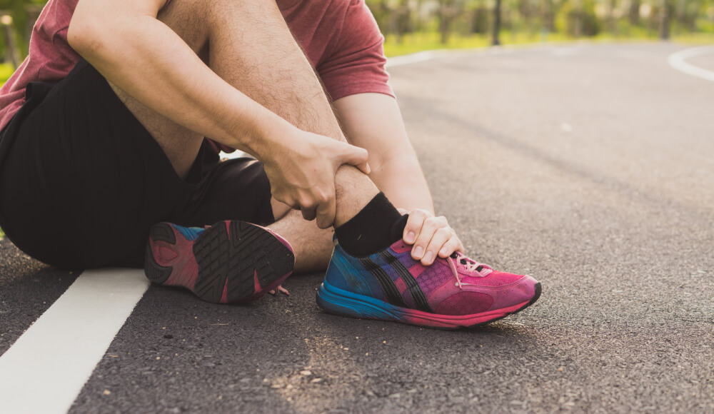 Four conditions that cause pain on top of the foot near the ankle shutterstock 1566090322 pain on top of foot near ankle