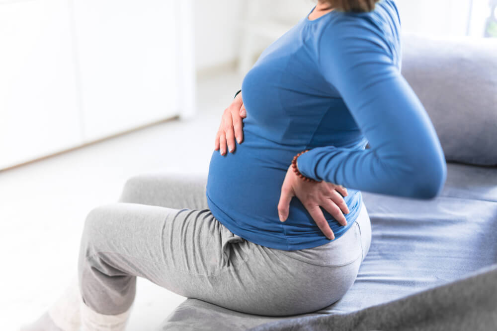 Is it normal to have lower back pain in the early stages of pregnancy? is lower back pain normal in the early stages of pregnancy?