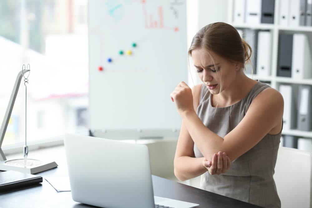 Why does my elbow hurt when I work at a desk all day? shutterstock 1231313257 why does my elbow hurt