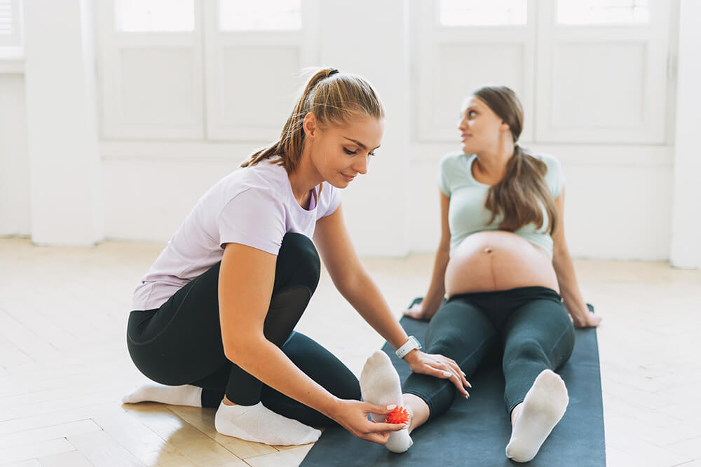 8 expert suggestions for managing postpartum foot pain the trainer massages pregnant woman s feet with sp 2022 11 12 05 18 26 utc 8 expert suggestions for managing postpartum foot pain foot pain